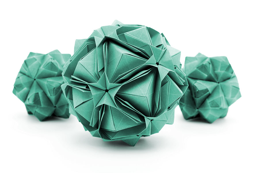 Three green origami polyhedron paper craft.
