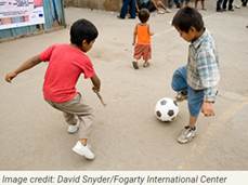 A few kids playing with a football ball Description automatically generated with low confidence